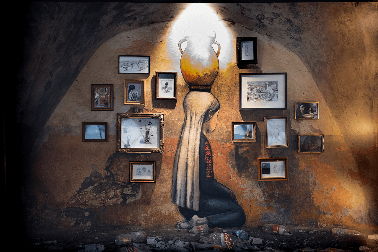 Exposition "Empreinte Carbone" par Seth, photographie d'une fresque peinte à Qalandia, territoire palestiniens